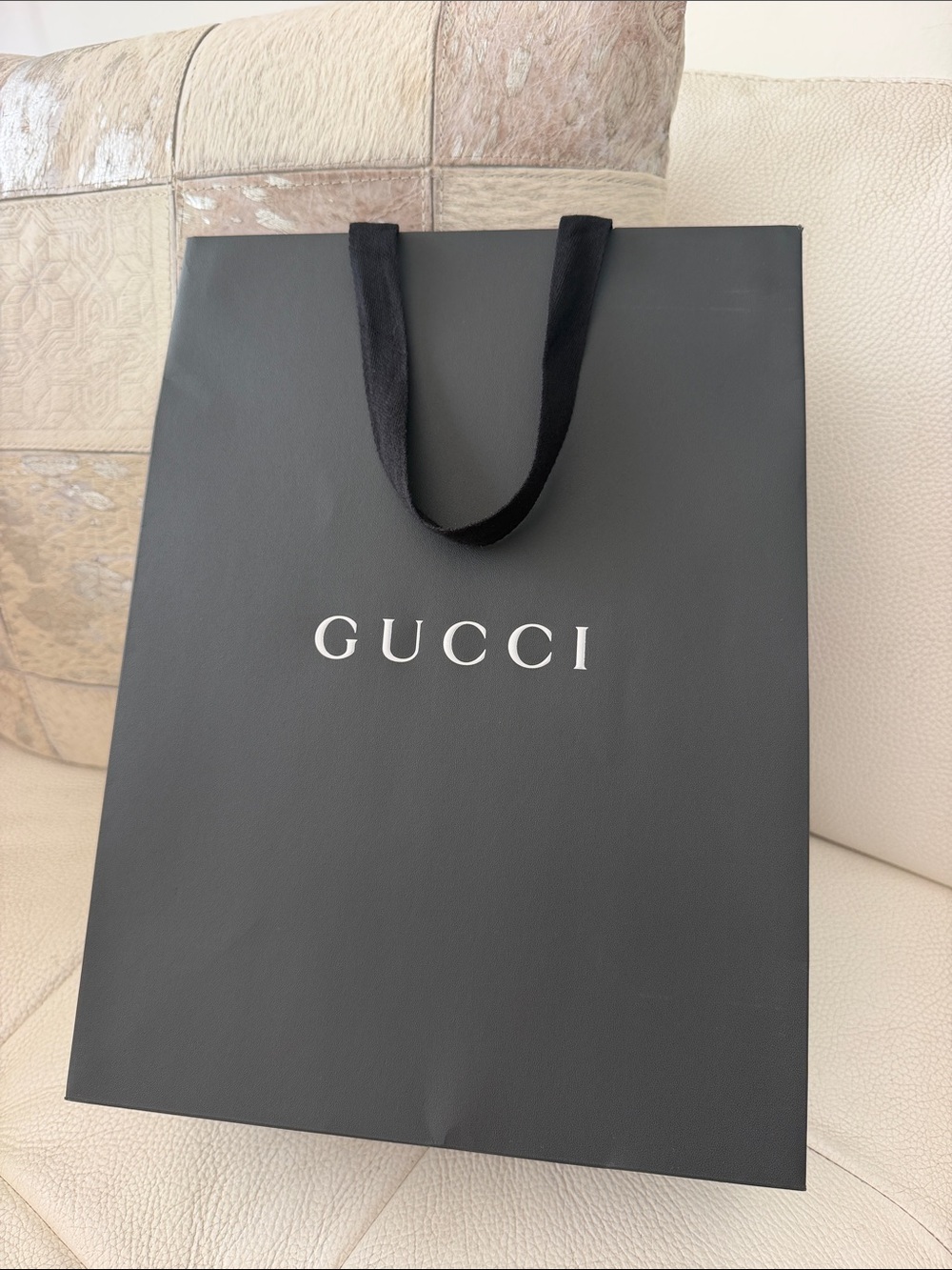 Black Gucci shopping bag